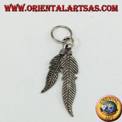 Silver pendant with two Native American style feathers