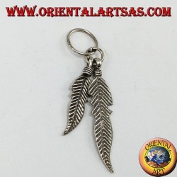 Silver pendant with two Native American style feathers