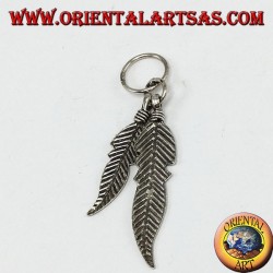 Silver pendant with two Native American style feathers