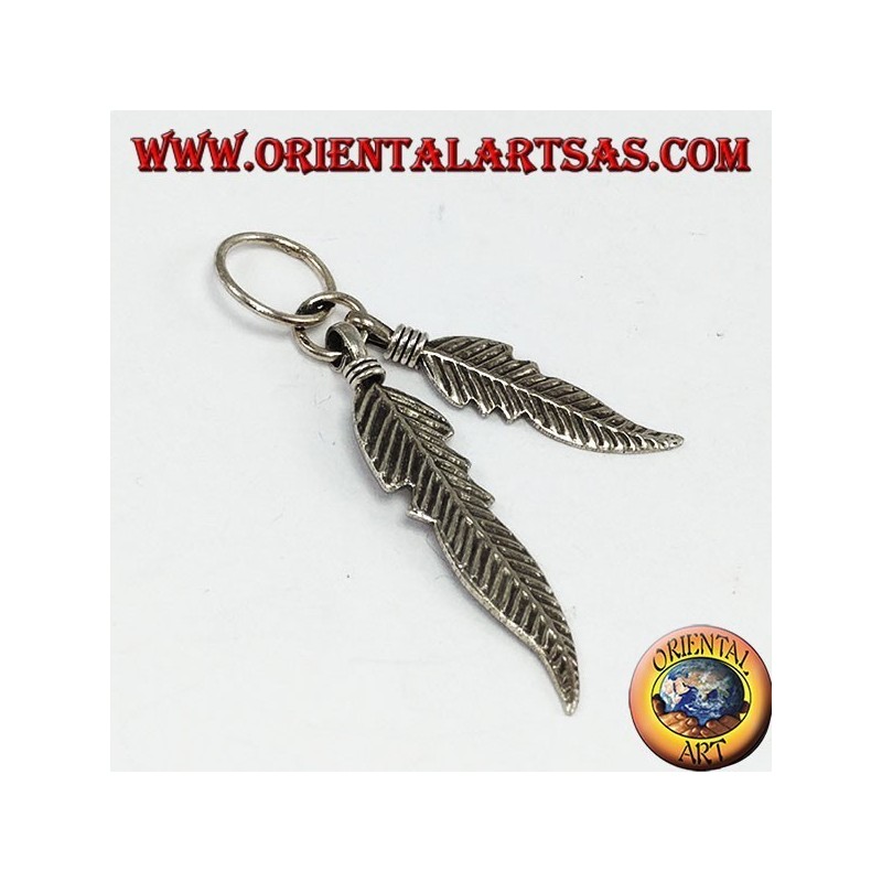 Silver pendant with two Native American style feathers