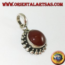 Silver pendant with round carnelian and border with two rounds of spheres
