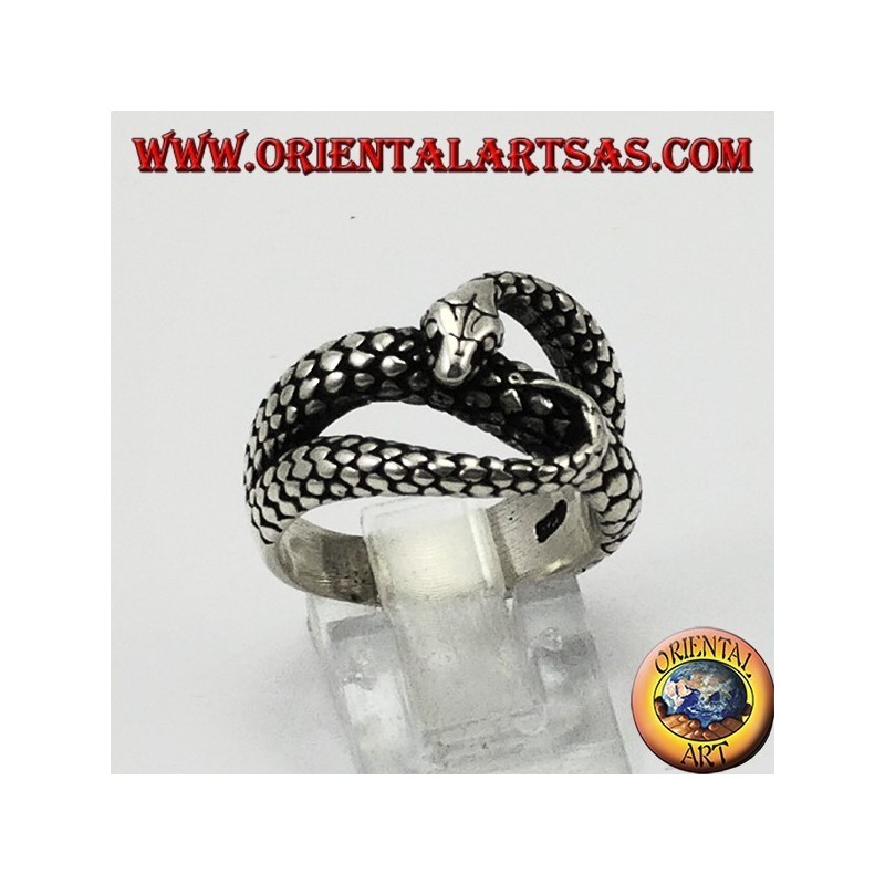 Silver ring in the shape of a cobra snake that bites