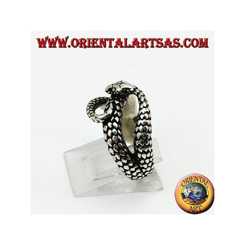 Silver ring in the shape of a cobra snake that bites
