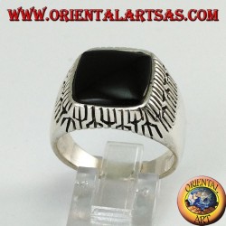 Silver ring with square onyx surrounded by engravings