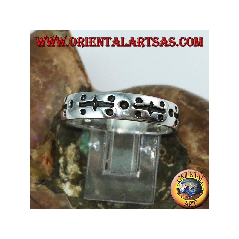 Silver ring in hand engraved with dots