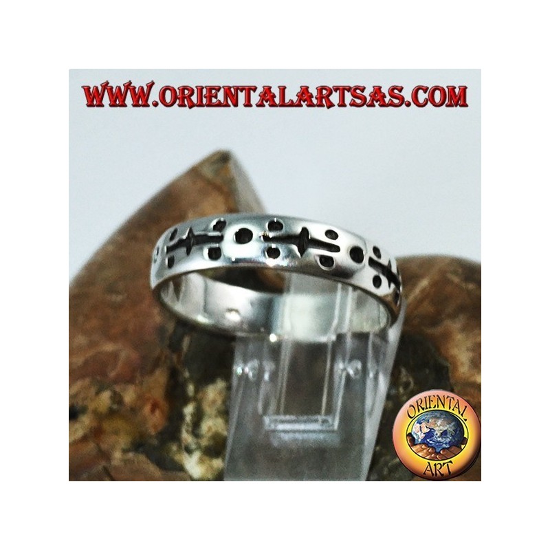 Silver ring in hand engraved with dots
