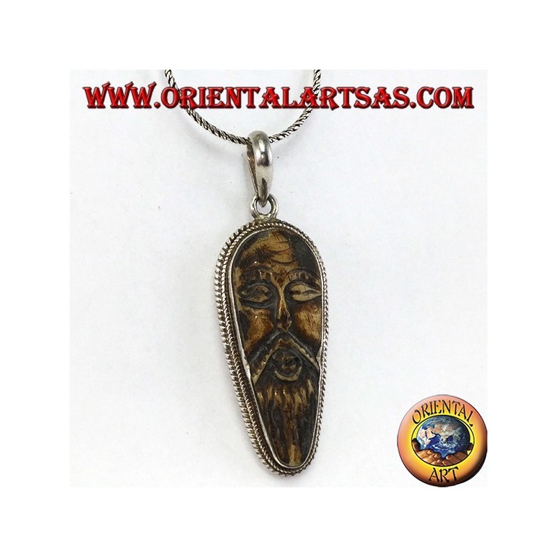 Silver pendant in old wise carved in yack bone