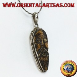 Pendentif en argent dans le vieux sage sculpté dans l'os d'yack