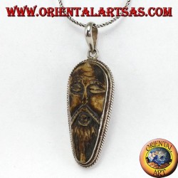 Pendentif en argent dans le vieux sage sculpté dans l'os d'yack