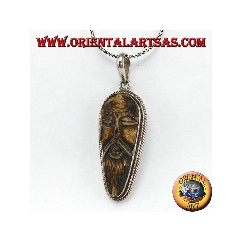 Silver pendant in old wise carved in yack bone