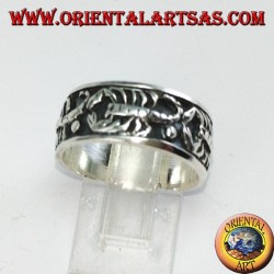 Silver band ring with bas-relief scorpions