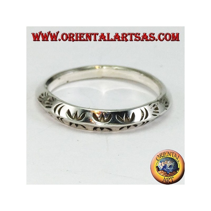 Silver ring with triangular profile carved by hand