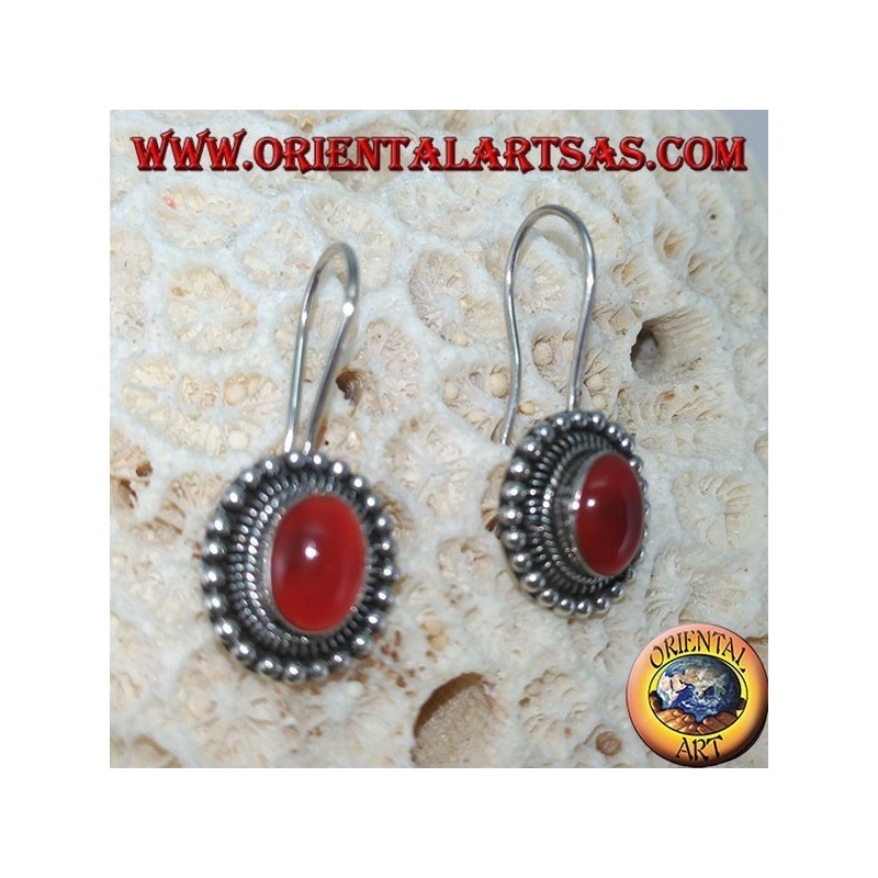 Silver earrings with oval carnelian is surrounded by dots