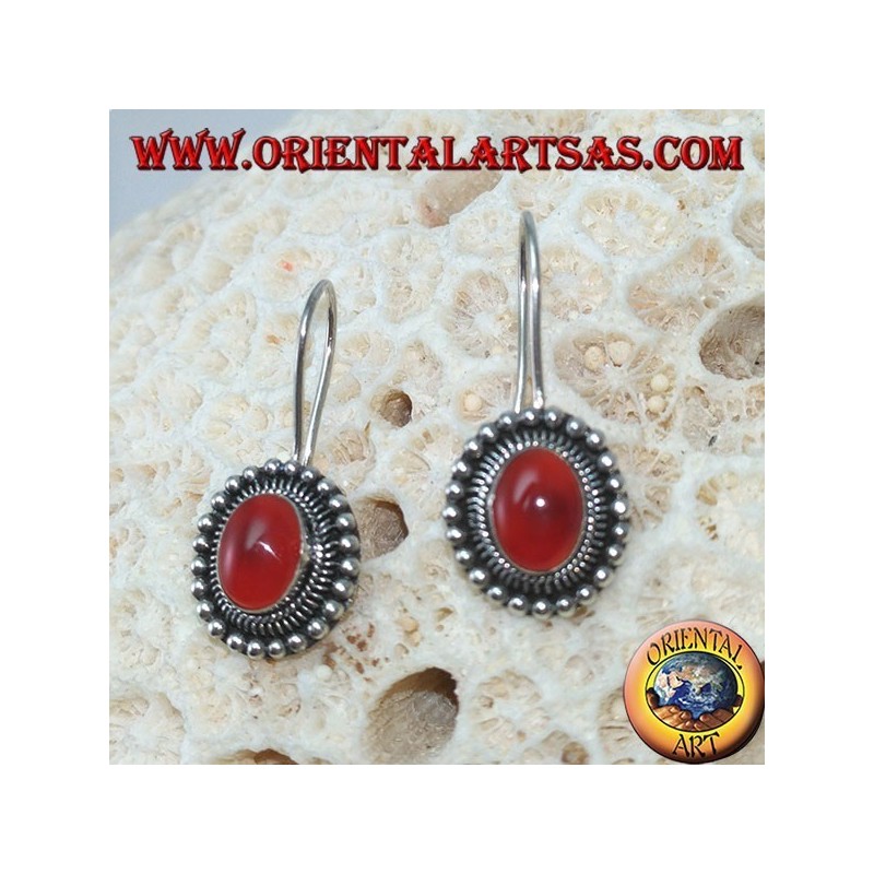 Silver earrings with oval carnelian is surrounded by dots
