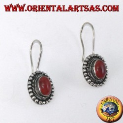 Silver earrings with oval carnelian is surrounded by dots