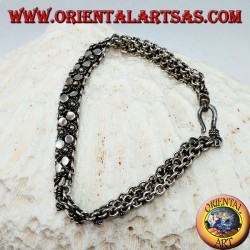 Silver bracelet with two rows of small flowers and round plates