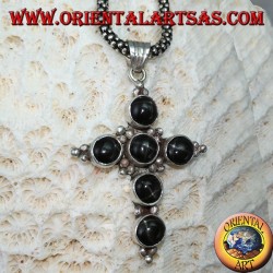 Silver cross pendant with six round black stars