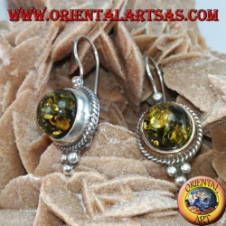 Silver earring with green hemisphere amber
