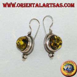 Silver earring with green hemisphere amber