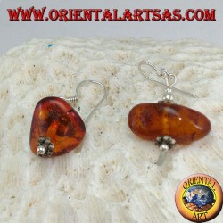Silver earring with a piece of amber