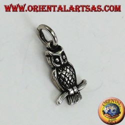 Silver pendant owl on the curved branch