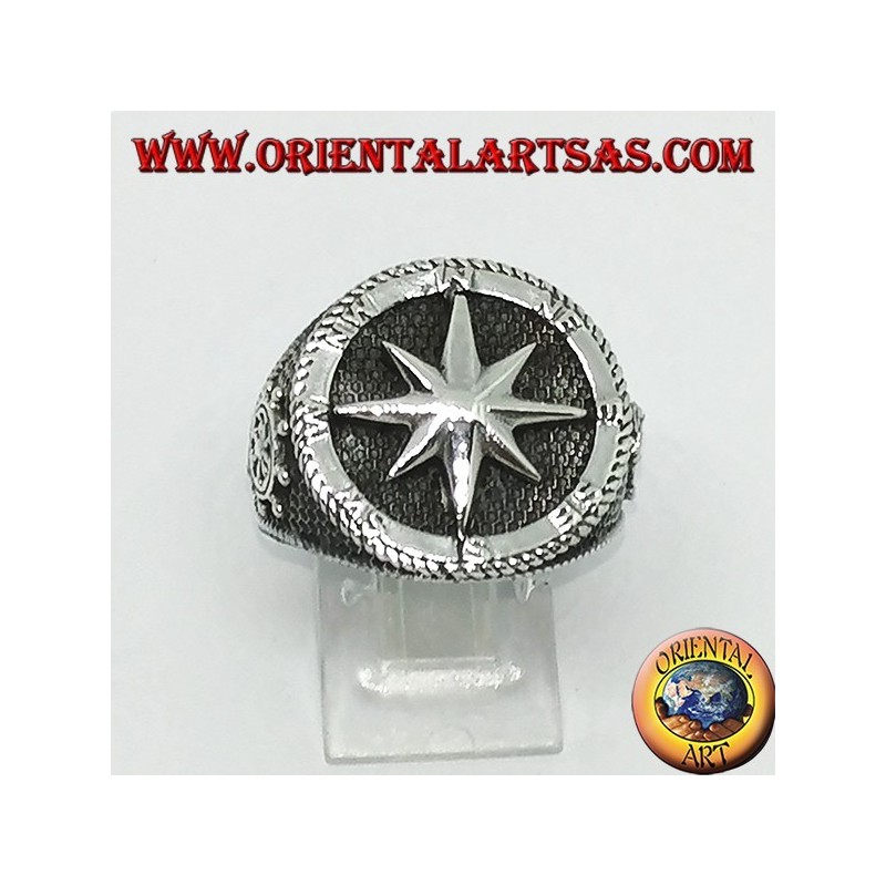 Silver ring with Compass rose, rudder and still on the sides