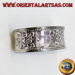 Hand-chiselled wide silver bracelet with square floral motifs
