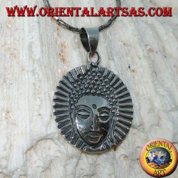 Silver pendant head of a radiant Buddha