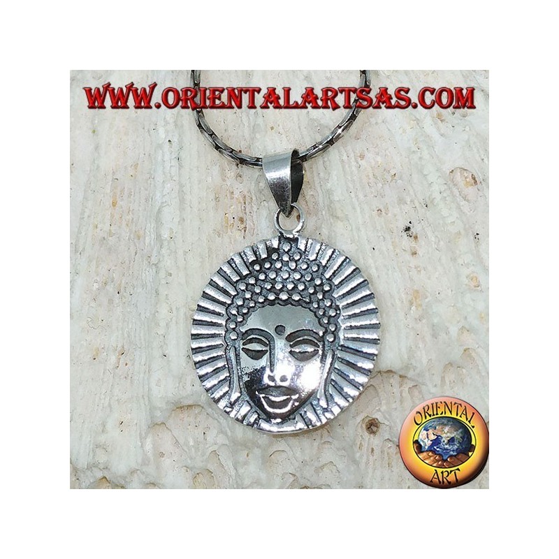 Silver pendant head of a radiant Buddha
