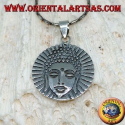 Silver pendant head of a radiant Buddha