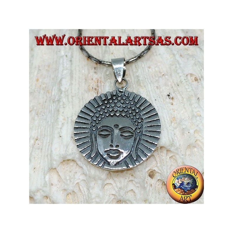 Silver pendant head of a radiant Buddha