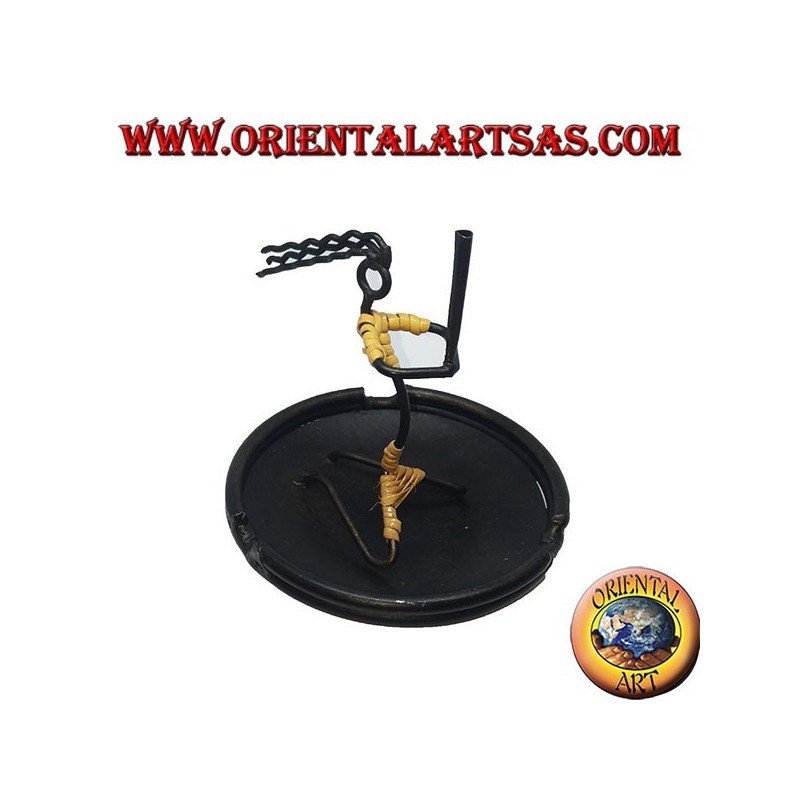 Burning incense, wrought iron ashtray, the cracked