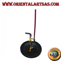 Burning incense, wrought iron ashtray, the cracked