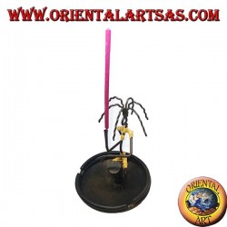 Burning incense, wrought iron ashtray, the percussionist