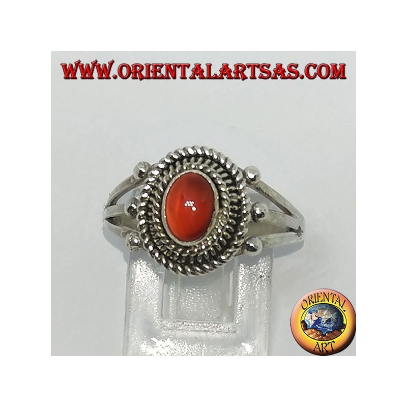 Silver ring with carnelian cabochon surrounded by three serpentine threads
