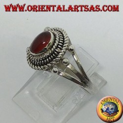 Silver ring with carnelian cabochon surrounded by three serpentine threads