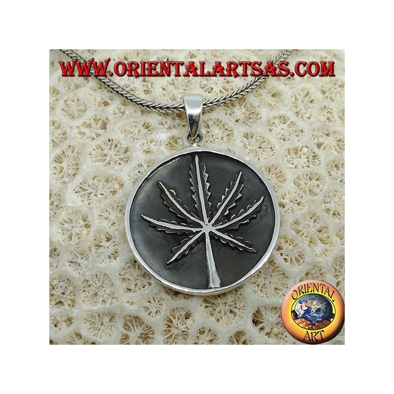 Silver medallion pendant with low-relief marijuana leaf