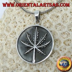 Silver medallion pendant with low-relief marijuana leaf