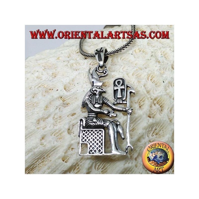 Silver pendant of the god Horus sitting on the throne
