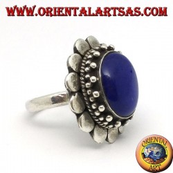 Silver ring with oval lapis lazuli surrounded by round plates