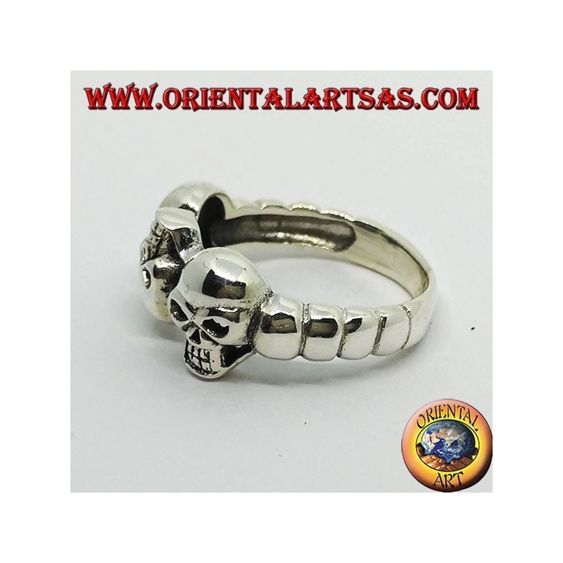 Silver skull ring with garnet eyes