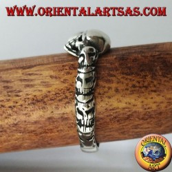 Silver ring with three skulls with bone
