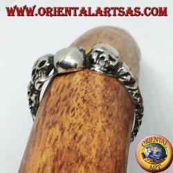 Silver ring with three skulls with bone
