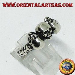 Silver ring with three skulls with bone