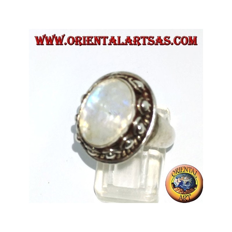 Silver ring with oval rainbow moonstone and set with a studded edge with dots