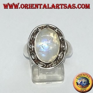 Silver ring with oval rainbow moonstone and set with a studded edge with dots