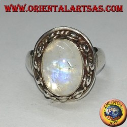 Silver ring with oval rainbow moonstone and set with a studded edge with dots