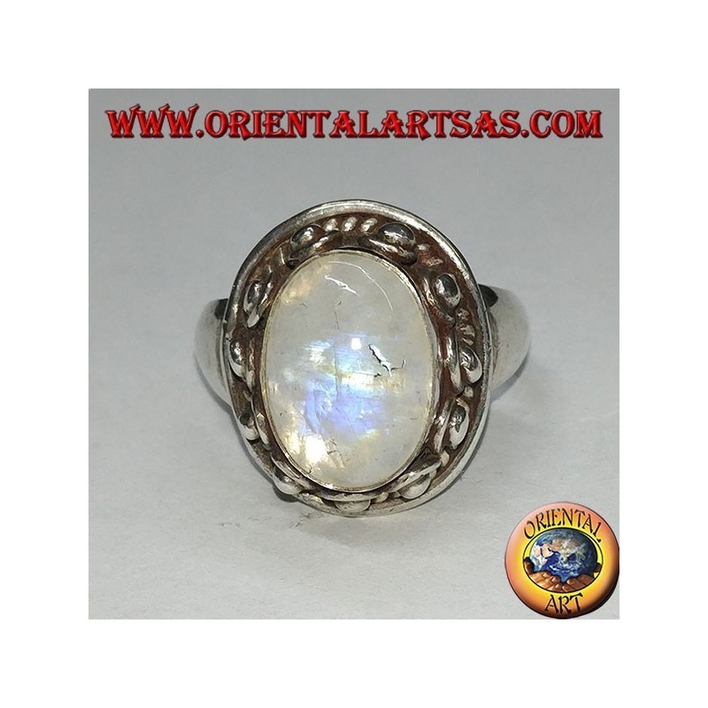 Silver ring with oval rainbow moonstone and set with a studded edge with dots