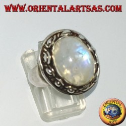 Silver ring with oval rainbow moonstone and set with a studded edge with dots