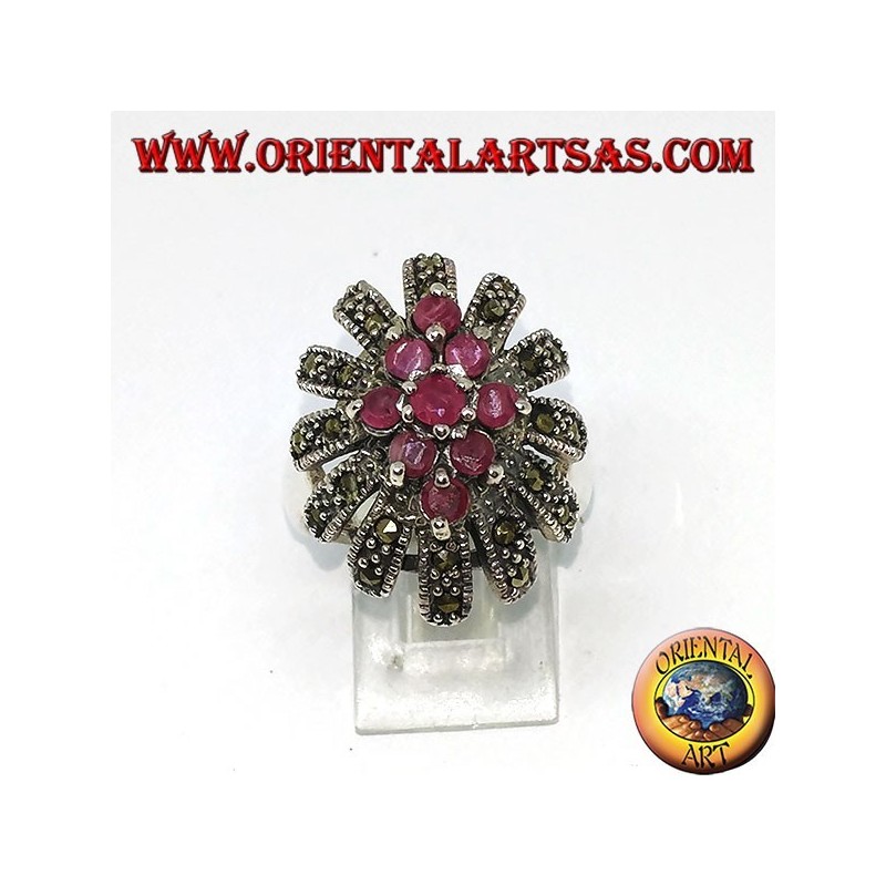 Silver ring, oval high with 9 rubies set surrounded by marcasites